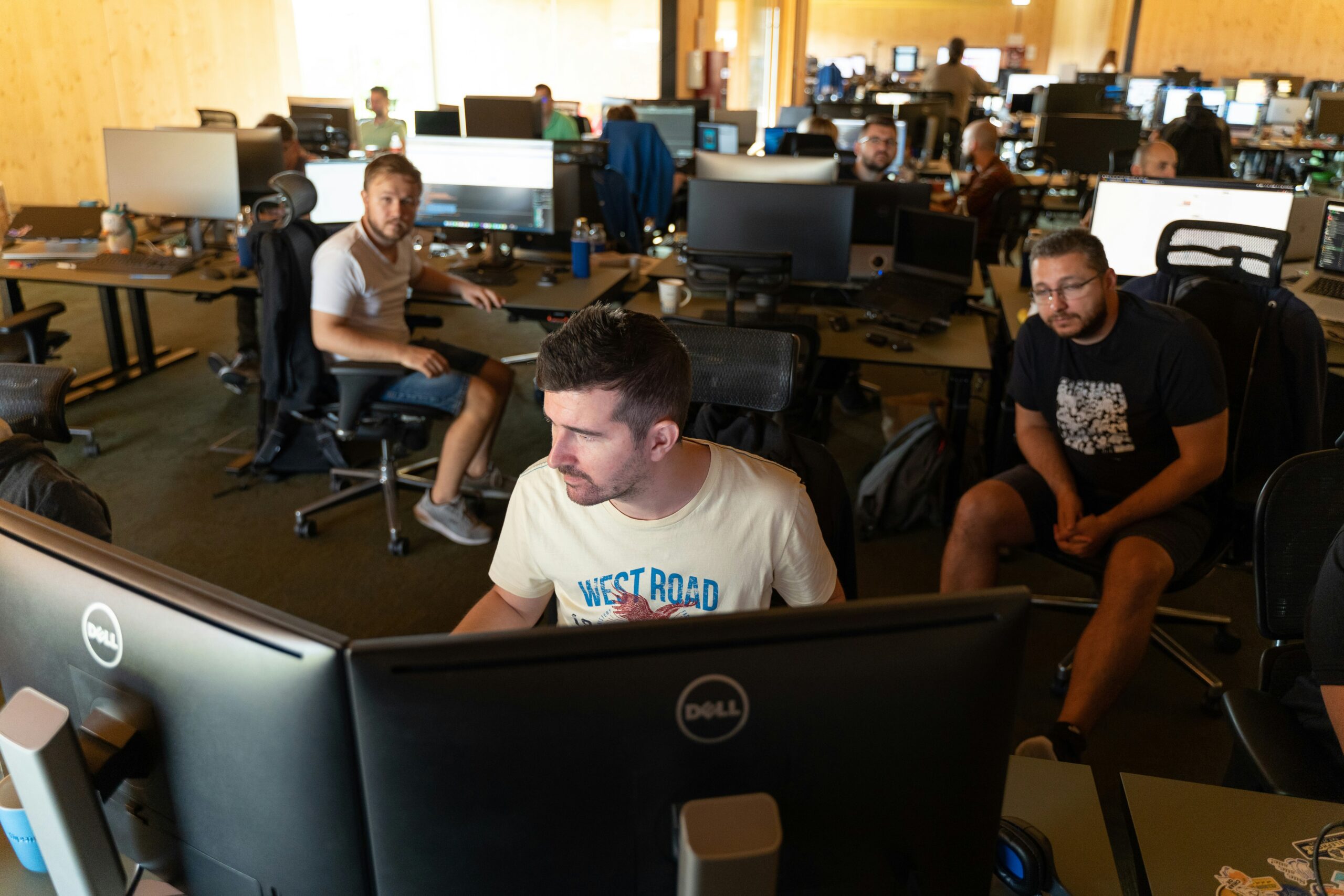 The cast of Mythic Quest in their game studio, reacting to an on-screen 'Game Over' message in the series finale.